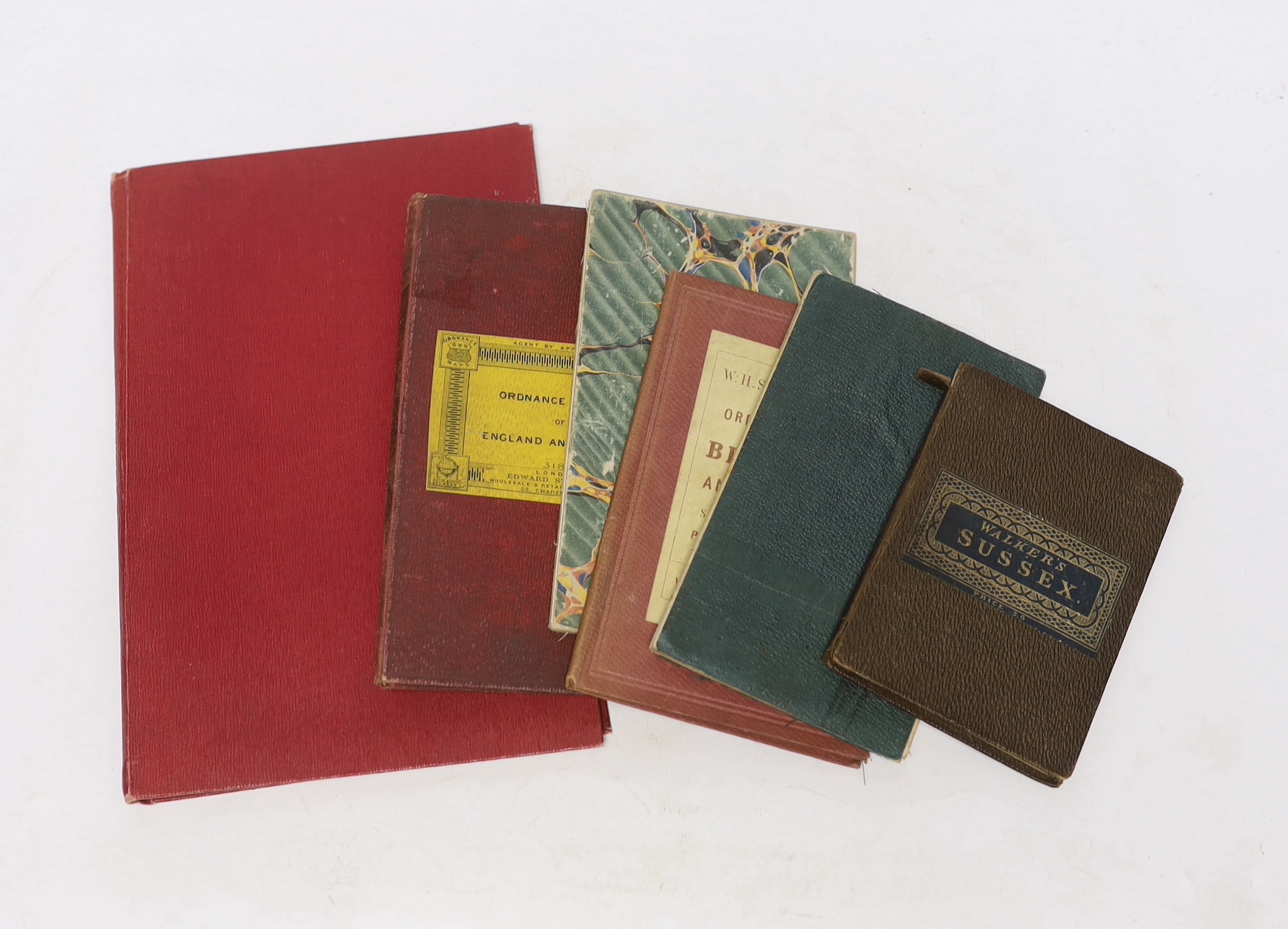 Six 19th and 20th century folding maps of Sussex; an Ordnance Survey (318), a W.H. Smith & Son map, a Smith & Son 172 Strand 1864, two Walker’s County Maps, and a Kelly’s Map